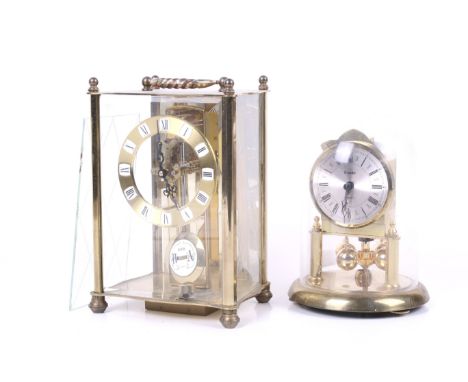 Three contemporary brass clocks and three domes. Including a Kern West German anniversary clock, having a chrome and brass di