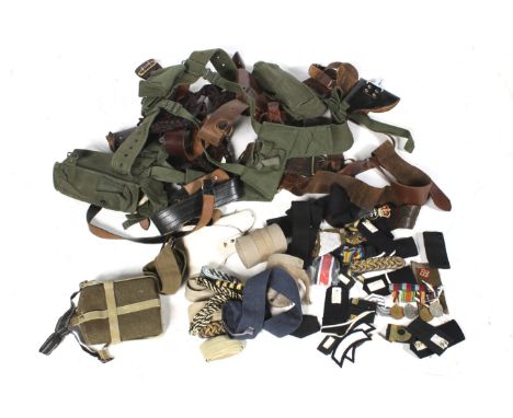 A large quantity of 20th century and contemporary military accessories. Including a leather holster, sleeves, military patche