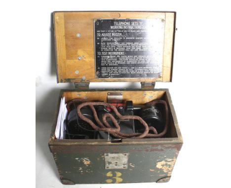 A pair of WWII Bakolite type 'F' army field telephone sets in cases. Adapted to use C cell batteries (the modification has be