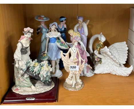 A group of mixed ceramic and resin figures, tallest. 28cm.