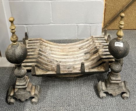 A cast iron and brass fire grate, W. 69cm.