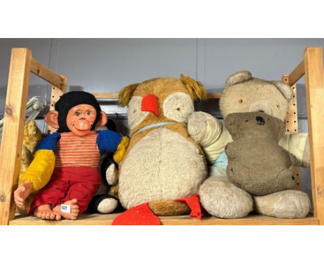 A group of vintage soft toys.
