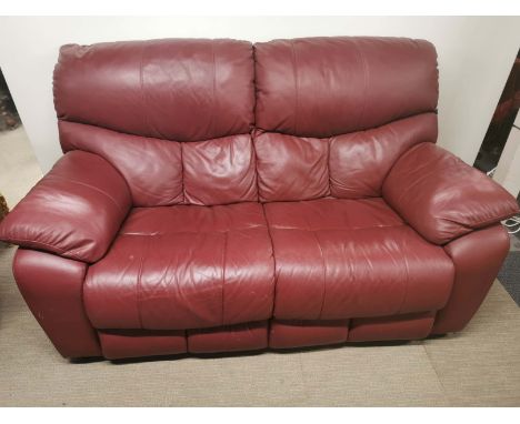 A burgundy coloured leather sofa, L. 170cm H. 100cm.
