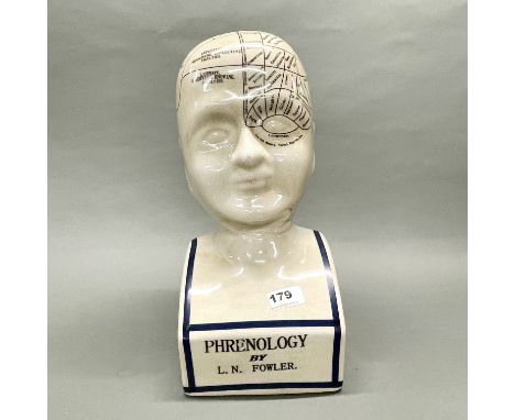 A ceramic phrenology head, H. 40cm.
