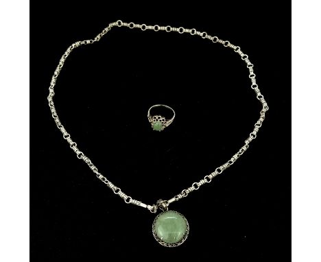A 925 silver jade and marcasite pendant on a silver chain, L. 50cm, together with a 925 silver jade set ring, (N).