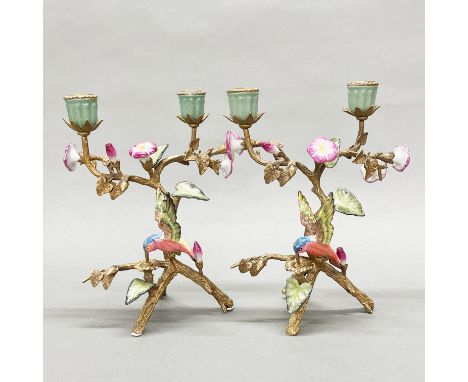 A pair of continental bronze and porcelain candelabra, H. 26cm.