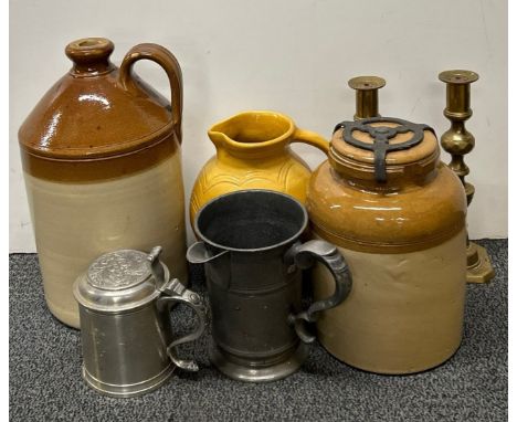 A group of stoneware, jars, pewter tankard and brass candlestick.