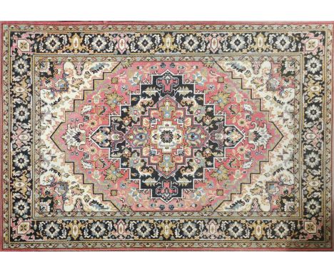 A vintage patterned rug, 282 x 200cm.