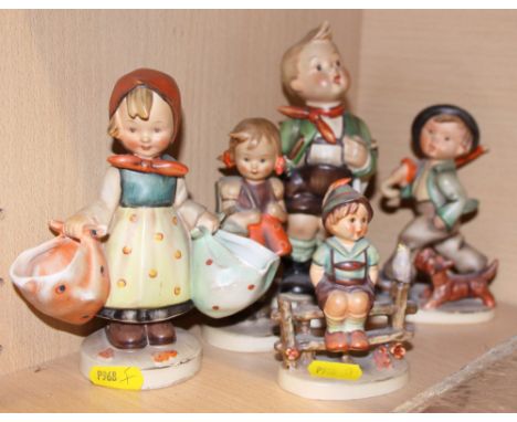 Five Hummel figures of children, tallest 7 1/2" high, in various poses (damages)