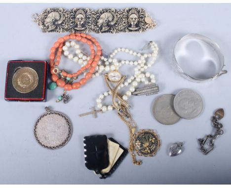 A silver hinged bangle, engraved with flower and leaf decoration, and various other jewellery and medals