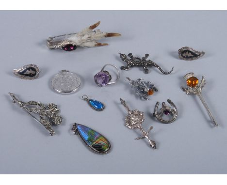 A Scottish silver mounted grouse foot brooch, various other silver and hardstone mounted brooches, a pair of ear clips, a har