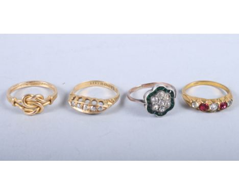 A late 19th century 18ct gold and diamond five stone dress ring, 2.7g, an 18ct gold knot ring, 3g, and two other rings