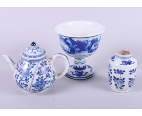 A Chinese porcelain blue and white landscape decorated stem cup, 4 1/2" high, a Kangxi vase, 3 1/4" high, and a teapot, 4 1/2