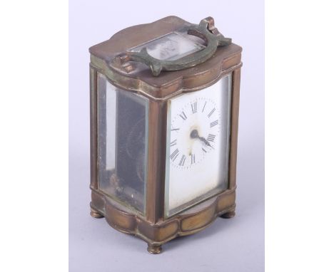 A brass shaped cased carriage clock, 5" high