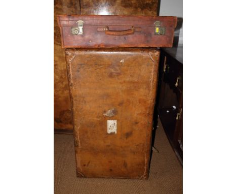 A leather trunk and a leather suitcase