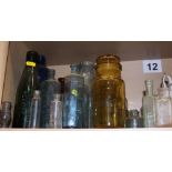 A large collection of medicine and other glass bottles
