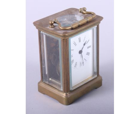A brass cased carriage clock with enamel dial, 4 1/2" long