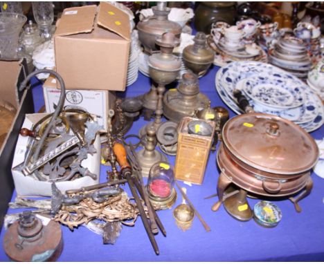 A number of brass and copper oil lamp reservoirs and a copper food warmer