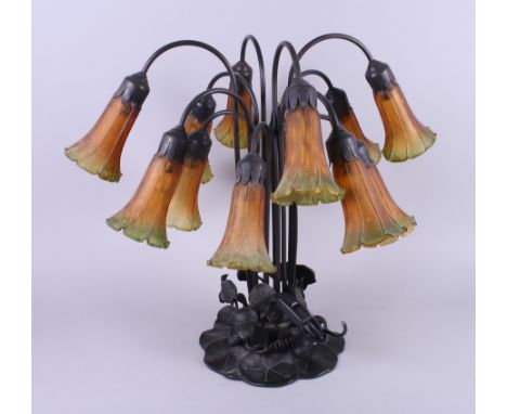 An Art Nouveau Tiffany style twelve-light table lamp, on water lily base, 21" high