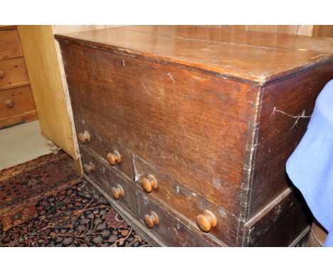 A 19th century oak mule chest, fitted four small drawers, on bracket feet, 39" wide