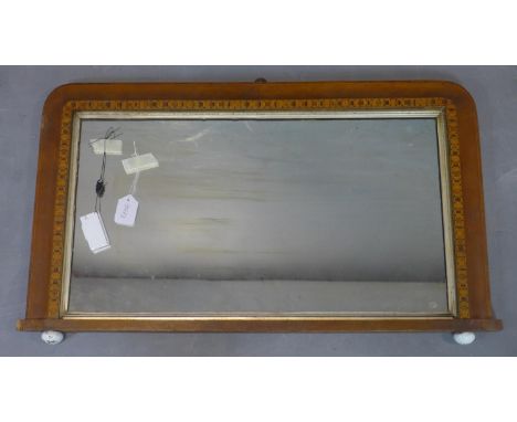 An inlaid overmantle mirror with original glass plate, on ceramic ball feet, 49 x 85cm 