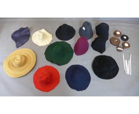 A group of hat making tools including twelve pieces of felt and and ribbons 