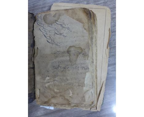 A 19th century Persian book, hand-written in Arabic and Persian in black ink and with annotations, together with two early 19
