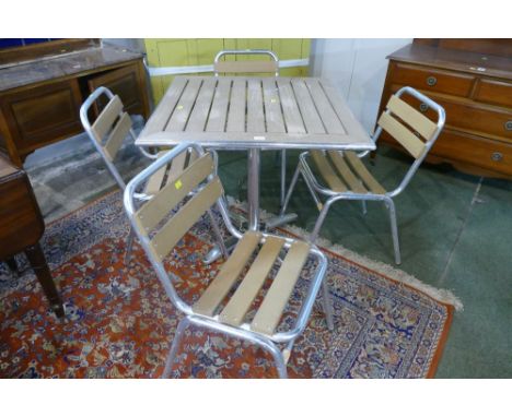 Composition and aluminium garden table with four chairs 