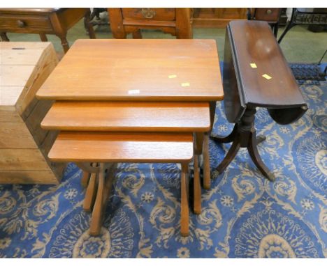 Nest of three teak tables and mahogany drop leaf table