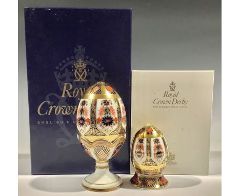 A Royal Crown Derby Imari palette 1128 pattern egg and stand, solid gold band, 14cm, gold button, printed mark, boxed; anothe