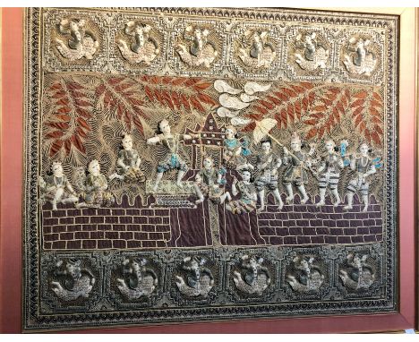 LARGE MID 20TH CENTURY BURMESE EMBROIDERED PANEL, depicting an archer and group of figures before an architectural feature an