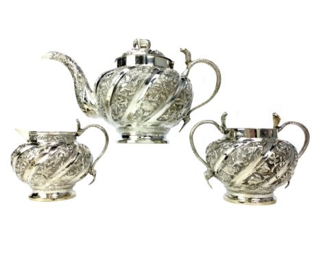 INDIAN SILVER THREE PIECE TEA SERVICE, each piece with bands in relief of animals, flowers and architectural features, the ha