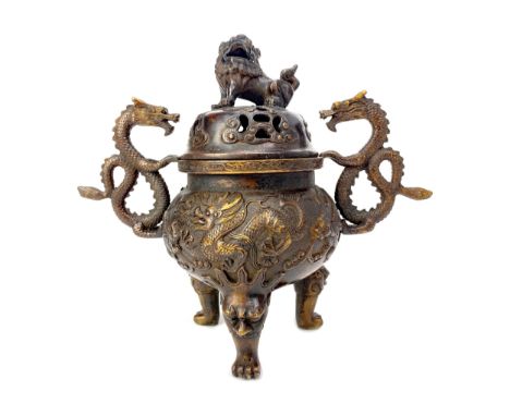 20TH CENTURY CHINESE BRONZE CENSER, the pierced lid with a foe dog finial, twin dragon handles, the body embossed with dragon