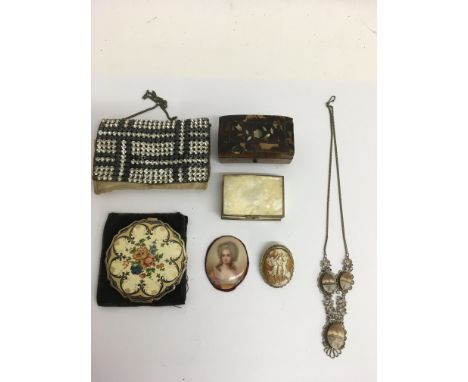 An unmounted painted porcelain portrait of an 18th century lady, a cameo brooch and filigree necklace of similar type plus ot