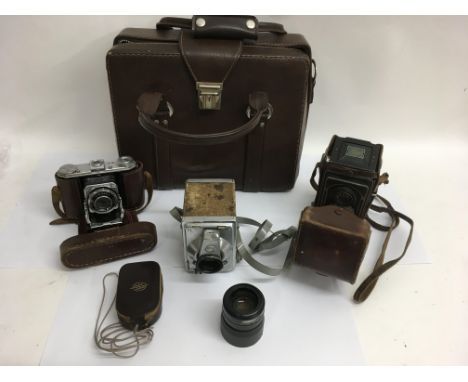 Three vintage camera comprising a Kodak Zeiss Icon, a Kodak Compur- Rapid and a Gilbert R.F.Hunter, plus a light meter and ba