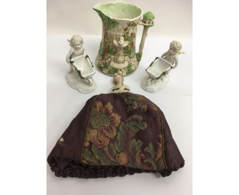 A pair of late 19th century continental figures, a Sylvac jug and pin head doll