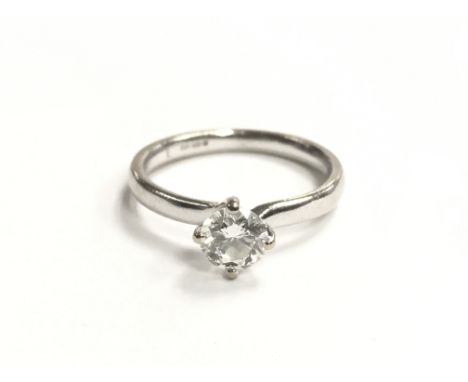 A ladies small 18ct white gold ring set with a singular 0.5ct diamond, ring size K, total weight approximately 2.7 grams.