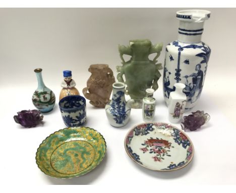 A boxed jade type carving along with a collection of other ceramics and vases.