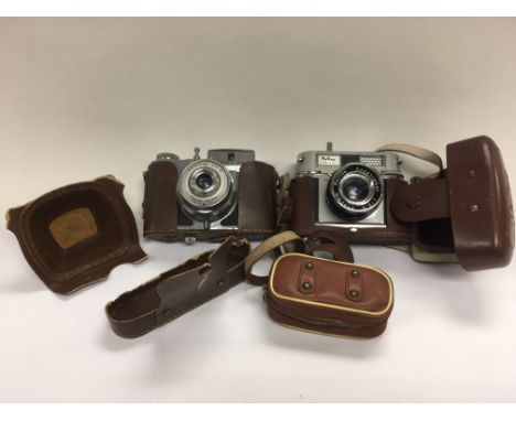 An Italian Bencini camera and a Halina Rolls camera (2).