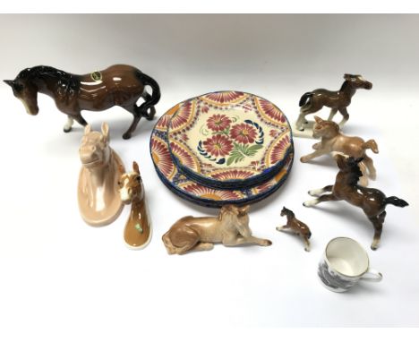 A small collection of ceramic horses including Beswick together with a collection of plates.