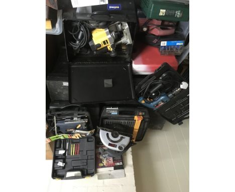 A box containing a collection of untested power tools including a dewalt router, Bosch drill etc