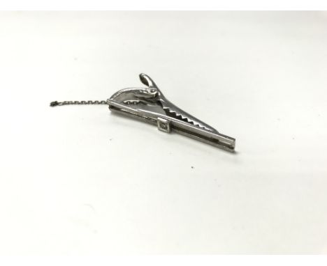 A white gold tie pin with diamond, weight approx 4.7g, a button hook pendant and a pearl tie pin