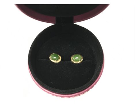 A pair of 14k jade earrings. Weight approx 3.55g.