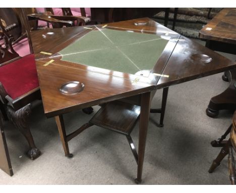An inlaid Edwardian card table, approx 112cm x 112cm x 72cm when opened.