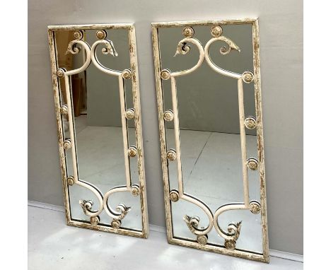 ARCHITECTURAL WALL MIRRORS, a pair, Regency style, aged metal frames, 112cm x 48cm. (2) 