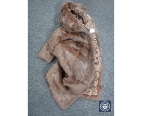 A lady's fur coat, brown, size 10. 