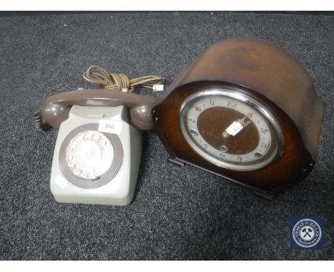 A two-tone vintage telephone and an oak cased mantel clock 