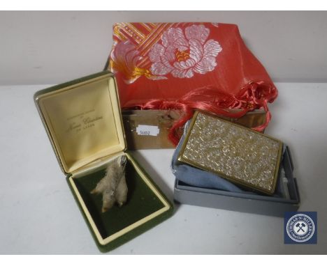A box of hand-stitched scarf, musical compact and a rabbit foot Scottish brooch 