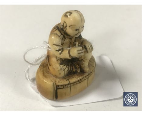 An ivory netsuke - Village Elder. 