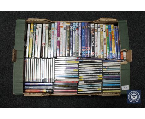 A collection of compact discs and DVD's.  (Q) 